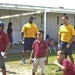 Two ESL Sailors join in a volleyball game at a local Guam school