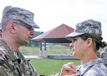 Pinninng on the Iowa National Guard Medal of Merit