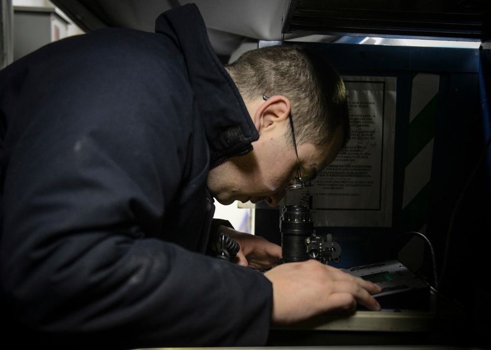 Sailor Performs Maintenance