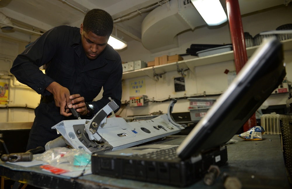 Sailor Performs Maintenance