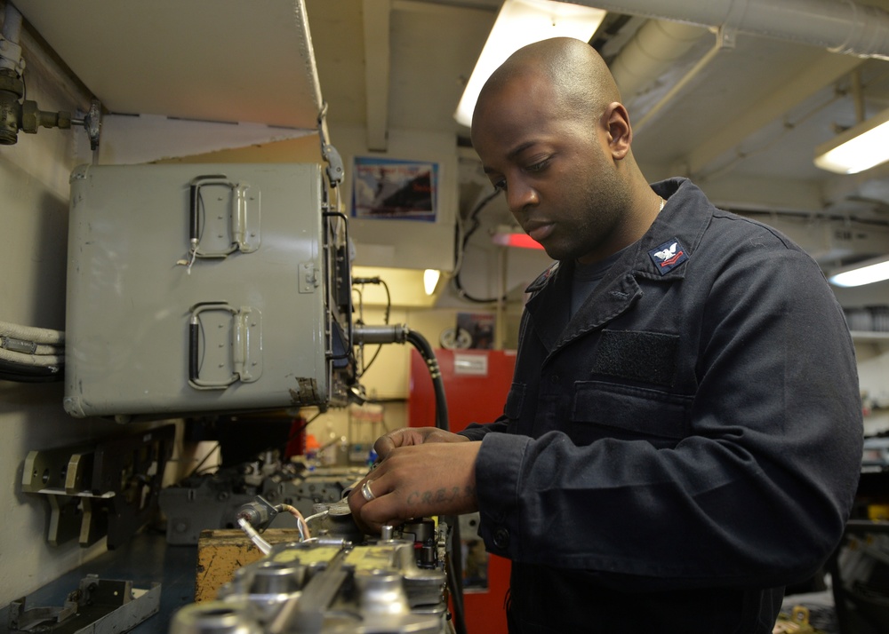 Sailor Performs Maintenance