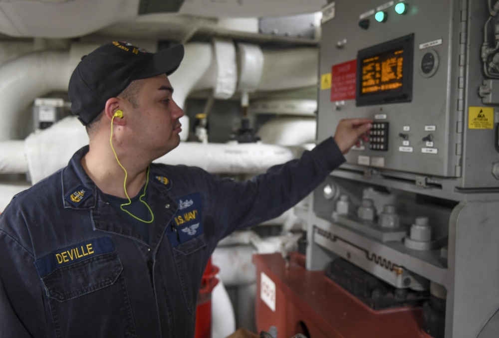 USS Wayne E. Meyer Engineer Checks Air Conditioning Unit