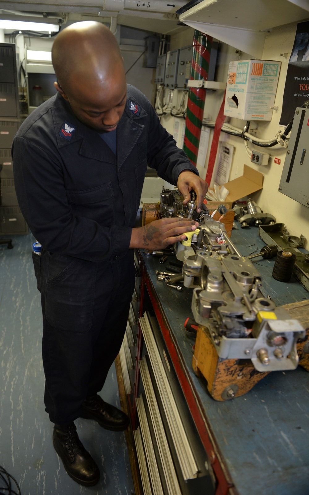 Sailor Performs Maintenance