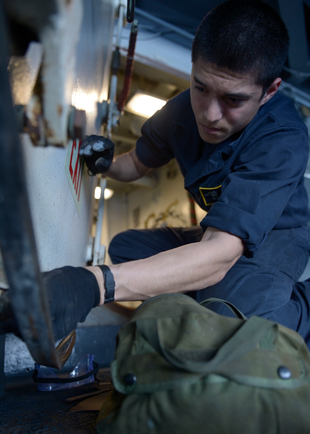 Sailor performs maintenance