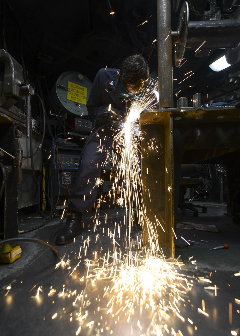 Sailor uses plasma cutter