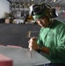 Sailors cleans airplane wing