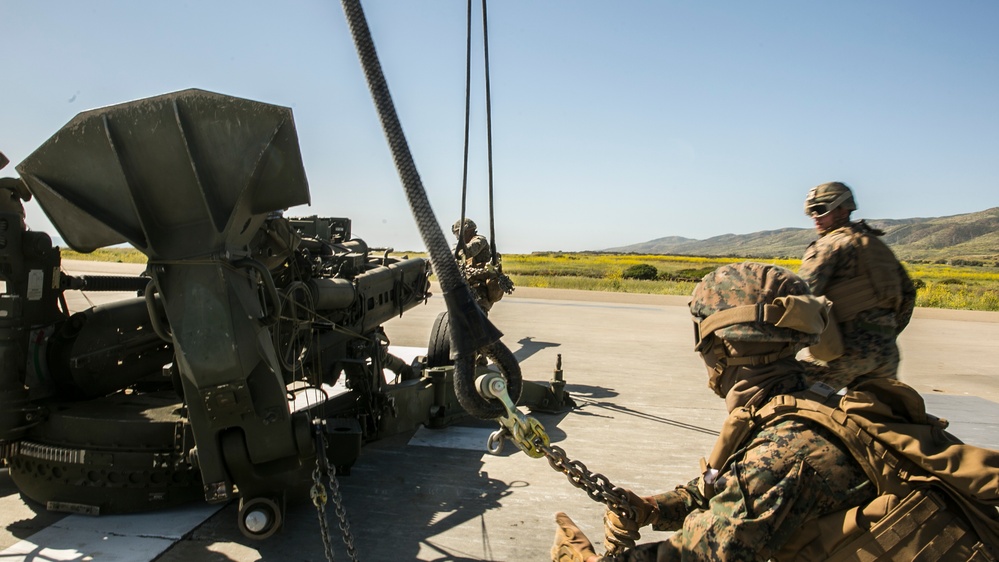 Delivering Artillery: CH-53E rapidly deploys the M777 Howitzer