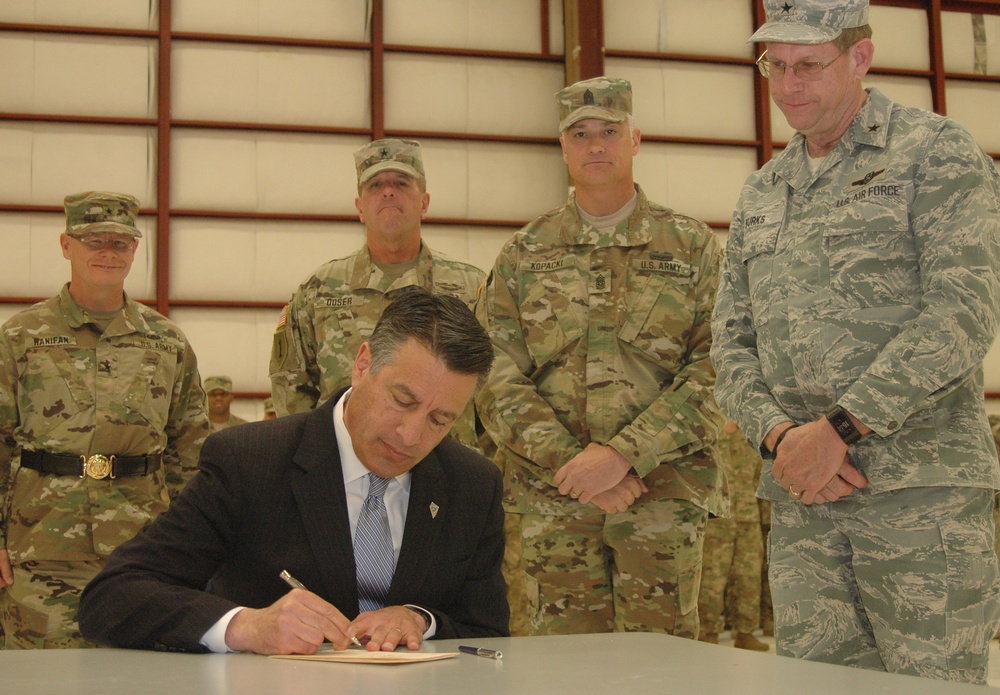 Nevada signal battalion Welcome Home Ceremony serves as backdrop for bill signing