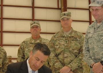 Nevada signal battalion Welcome Home Ceremony serves as backdrop for bill signing
