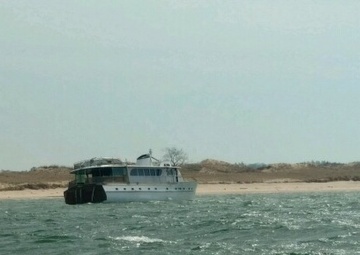 Coast Guard recovers operator off vessel he grounded after taking on water near Ludington, Mich.