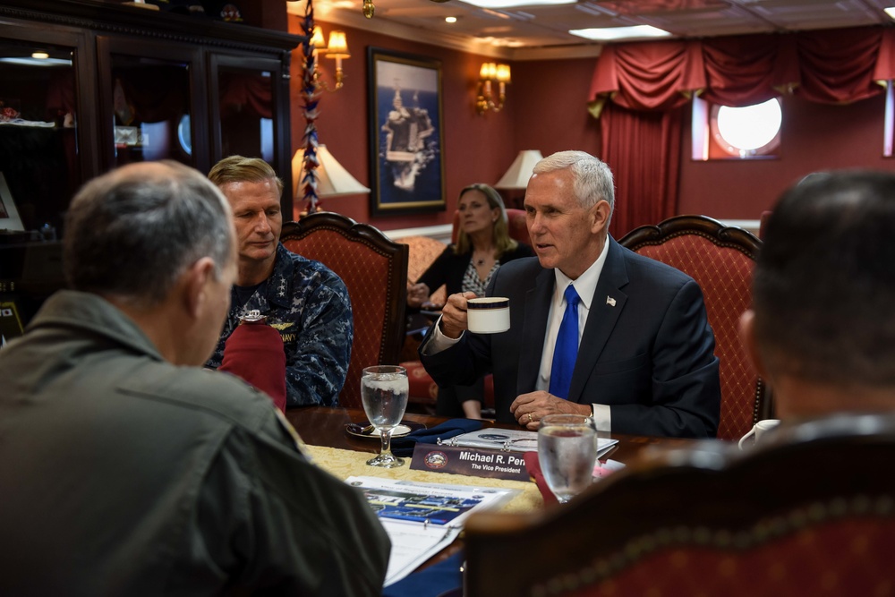 Vice President Michael R. Pence meets with senior officials in the commanding officer's inport cabin aboard Navy’s forward-deployed aircraft carrier, USS Ronald Reagan