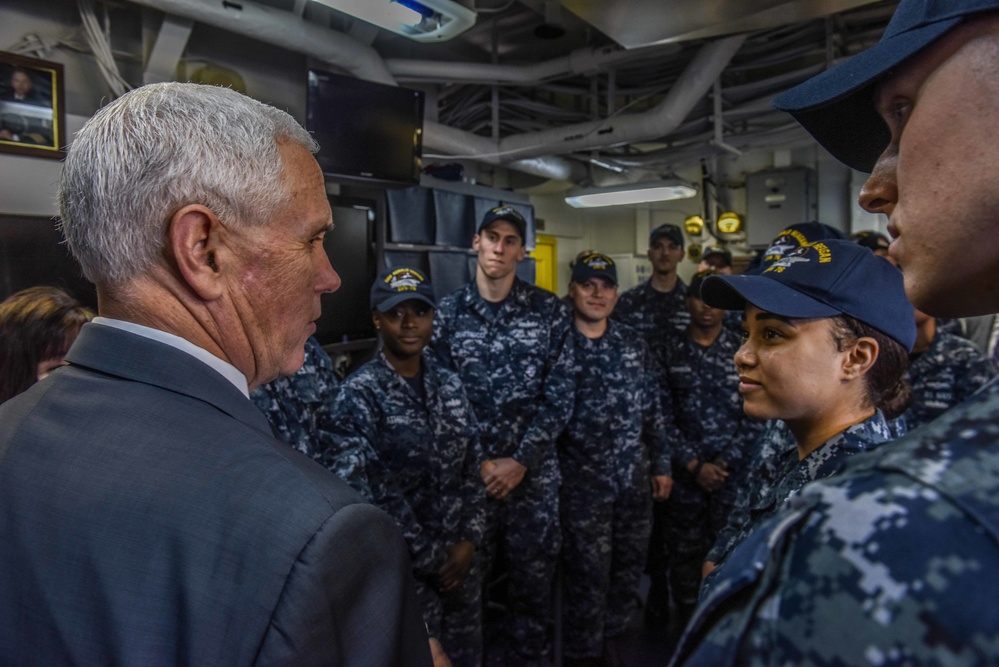 Vice President Michael R. Pence meets with junior service members in flight deck control of the Navy’s forward-deployed aircraft carrier, USS Ronald Reagan
