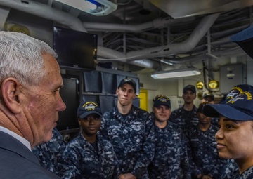 Vice President Michael R. Pence meets with junior service members in flight deck control of the Navy’s forward-deployed aircraft carrier, USS Ronald Reagan