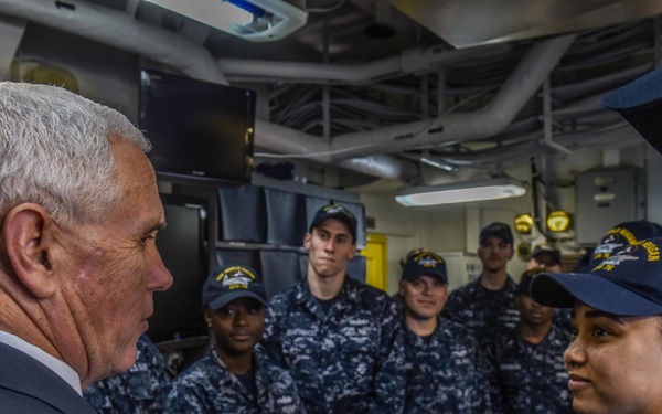 Vice President Michael R. Pence meets with junior service members in flight deck control of the Navy’s forward-deployed aircraft carrier, USS Ronald Reagan