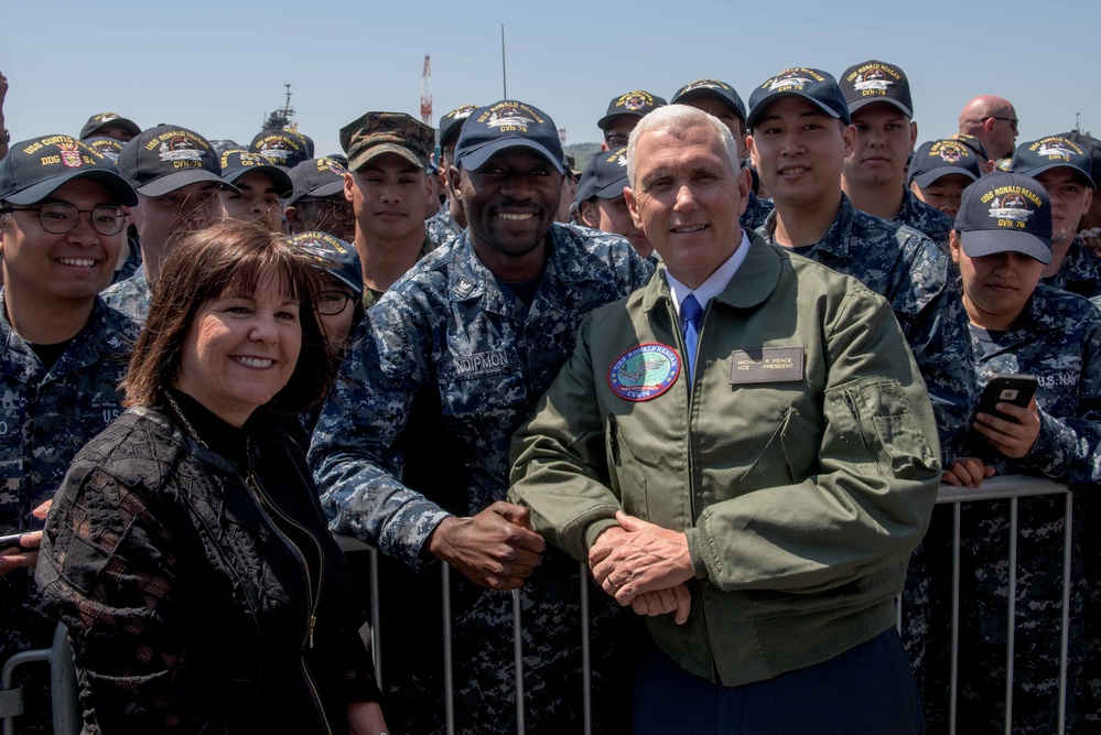 Vice President Michael R. Pence and Second Lady Karen Pence, Pose for a Photograph with Service Members on the Flight Deck of USS Ronald Reagan (CVN 76)