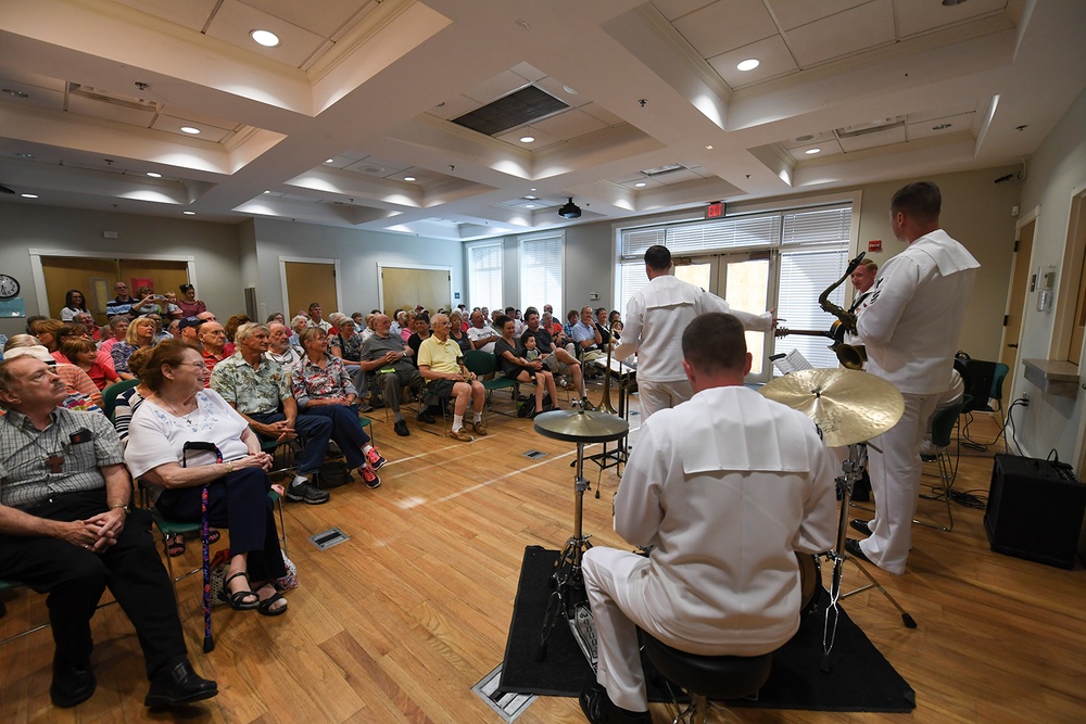 Navy Band Southeast’s Reception Combo performs at Headquarters branch of the Clay County Library for a local audience.
