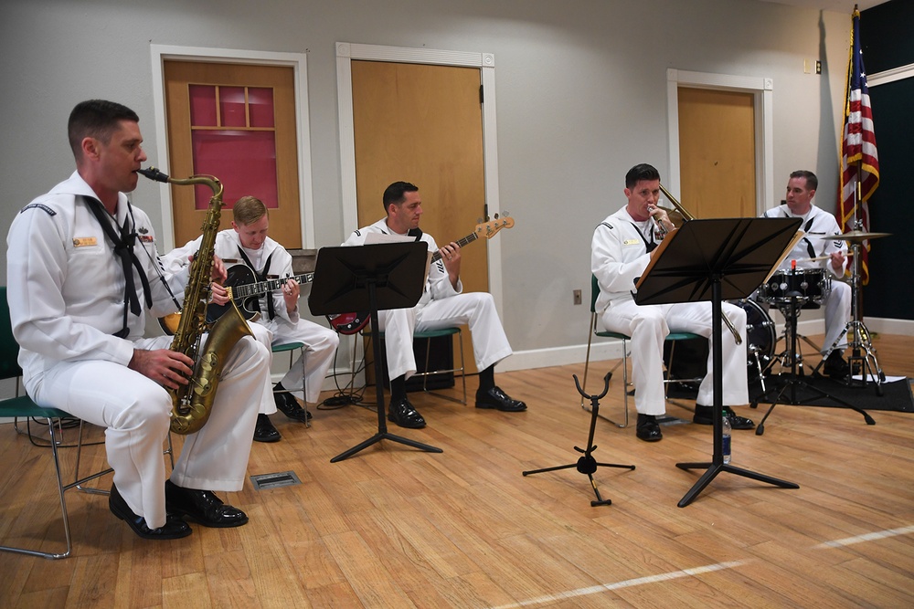 Navy Band Southeast’s Reception Combo performs at Headquarters branch of the Clay County Library for a local audience.