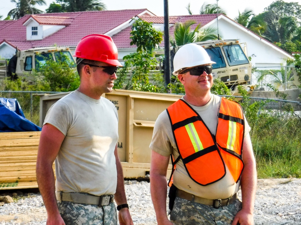 Sgt. Jason Klimesh and Spc. Patrick Ray Sgt. Jason Klimesh and Spc. Patrick Ray look over the Ladyville job site for safety compliance look over the Ladyville job site for safety compliance