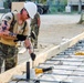 Sgt. Timothy Augustin drives a piece of rebar in a pre-drilled hole