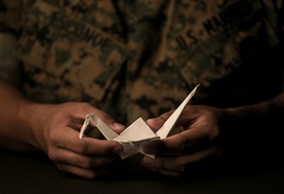 Marine behind the Legend of 1,000 Cranes