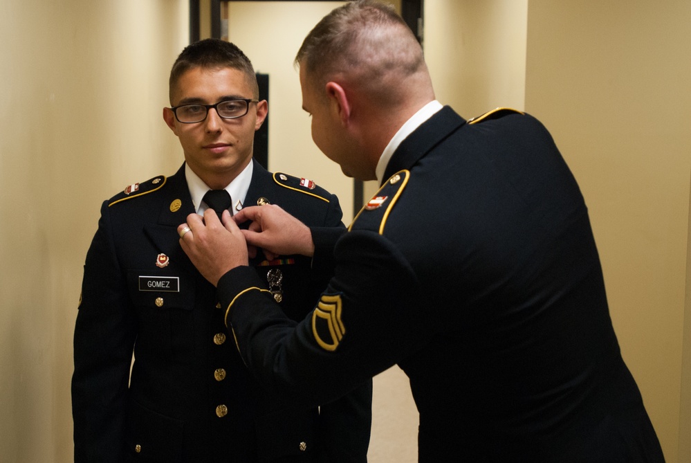 Pfc. Raymond A. Gomez prepares to enter a board interview