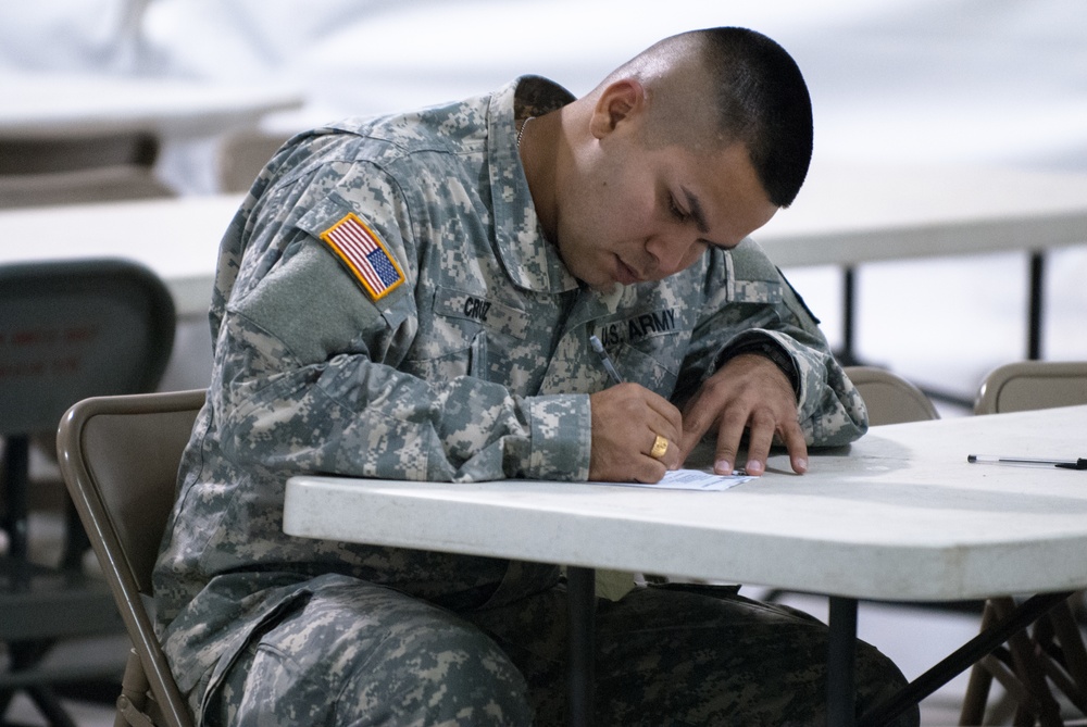Sgt. Roberto Cruz participates in the written exam portion of the 2017 Combined Best Warrior Competition