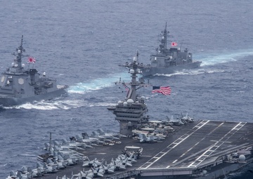 USS Carl Vinson (CVN 70), foreground, the Japan Maritime Self-Defense Force destroyer JS Ashigara (DDG 178), left, and the Japan Maritime Self-Defense Force Murasame-class destroyer JS Samidare (DD 106), back, transit the Philippine Sea