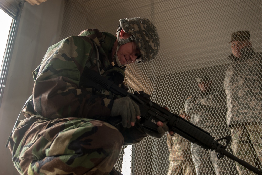 Soldier performs functions check on M4 carbine