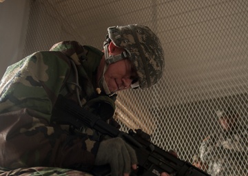 Spc. Wantae Seong performs a functions check of the M4 Carbine