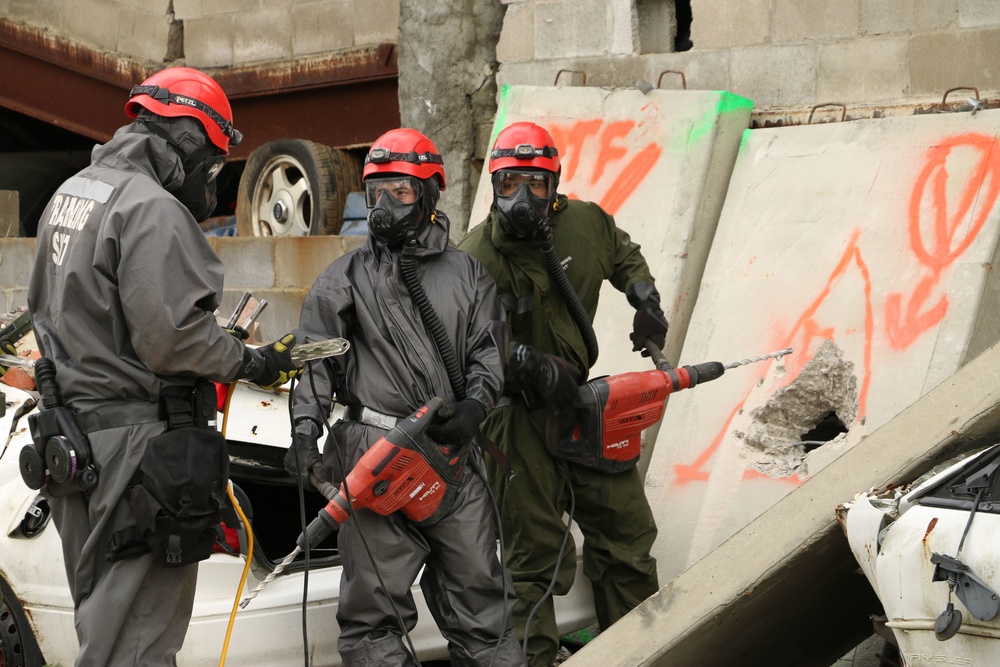Army engineers train for mass casualty recovery operations in a contaminated environment