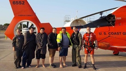 Coast guard aircrews hoist 4 people off of capsized boat