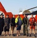 Coast guard aircrews hoist 4 people off of capsized boat