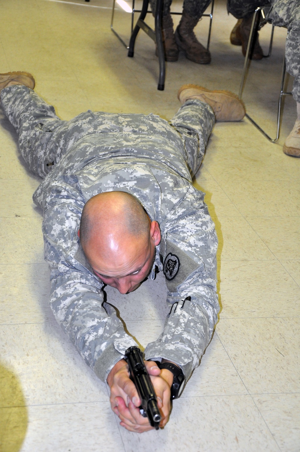 Demonstrating a prone firing position