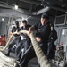 Sailors pull line in