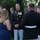 Marine Barracks Washington Evening Parade April 28, 2017 A formal outdoor military social event featuring U.S. Marine Corps personnel in dress blues conversing with civilian guests on a lawn. A senior officer wearing multiple service medals and ribbons is engaged in conversation with two women in formal attire. The setting appears to be an evening garden reception, likely at an official government or military residence.