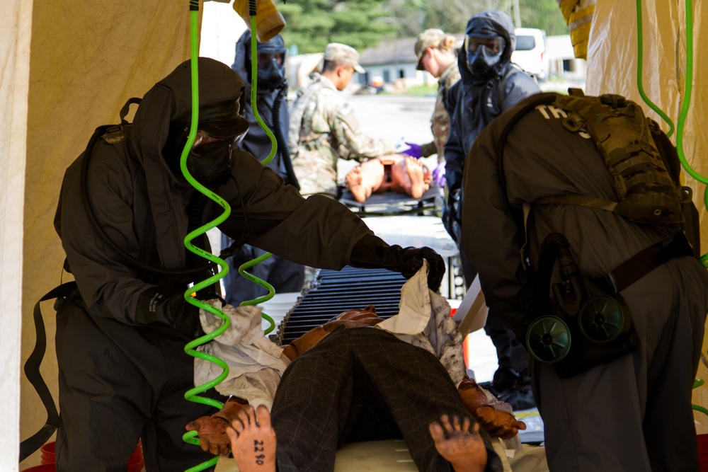 CBRN Soldiers decontaminate scenario victim