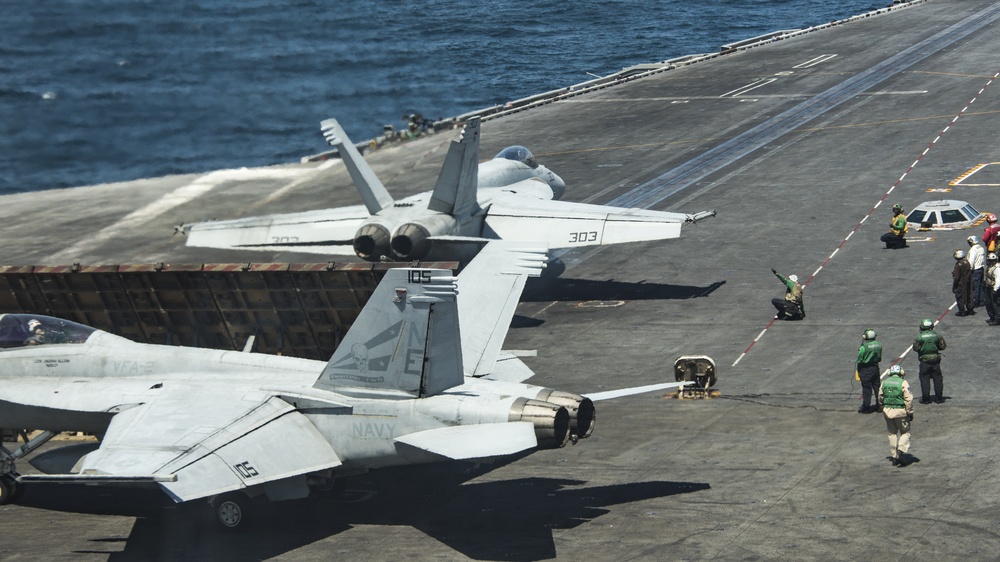 An F/A-18E Super Hornet from the “Golden Dragons” of Strike Fighter Squadron (VFA) 192 prepares to take off from the Nimitz-class aircraft carrier USS Carl Vinson (CVN 70)