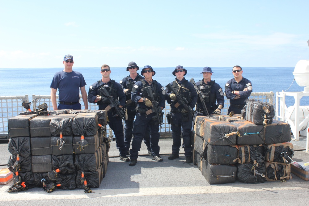 Coast Guard Cutter Dependable crew stands with interdicted narcotics