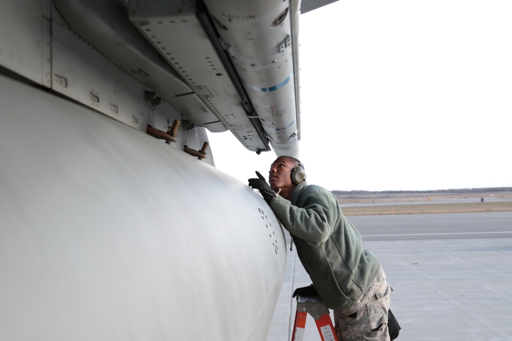 67th AMU Weapons Load Crewmembers put talons on their Eagles