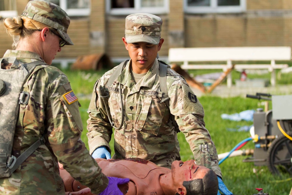 602nd Medic Evaluates Simulated Casualty Following Decontamination