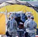 602nd Medics Await Simulated Casualty in Decontamination Process
