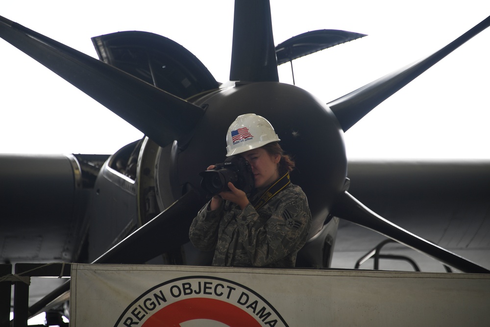 SrA Madeleine Richards photographs the removal of a propeller of a C-130J