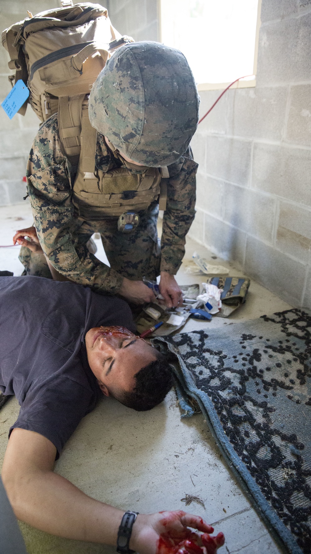 MOUT town mayhem: Marines practice life-saving skills during Squad Overmatch
