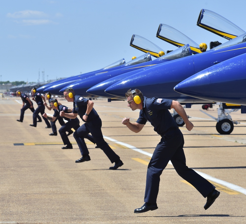 170505-N-IR734-221 BARKSDALE AFB, La. (May. 5, 2017) The U.S. Navy Flight Demonstration Squadron, the Blue Angels Crew Chiefs dash out in front of the jets at the Defenders of Liberty Air Show. The Blue Angels are scheduled to perform more than 60 demonst