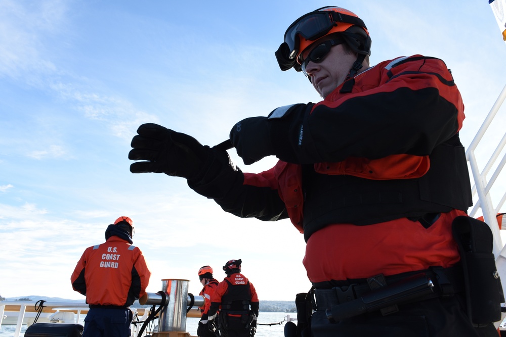 Coast Guard Cutter Swordfish crew launches rigid hull inflatable smallboat while underway in Wash.