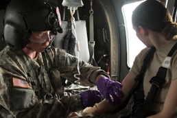 Flight medic places an IV
