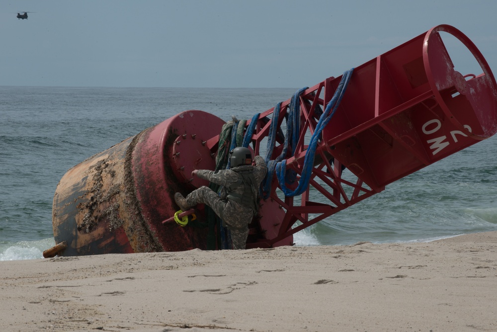 Coast Guard Cutter Oak, Connecticut National Guard team up to airlift beached buoy