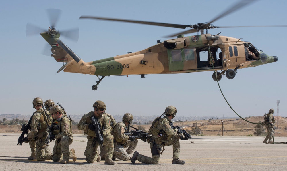 talian Airmen assigned to the 17th Special Operations Wing secure a landing pad during a fast roping exercise in Amman, Jordan during Eager Lion 2017.