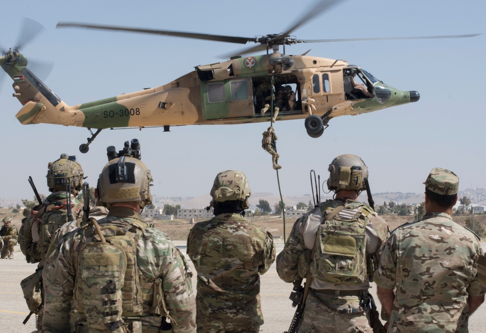 Members of the Air Force Special Operation's 23rd Special Tactics Squad observe Jordanian Special Operations conducting a fast roping exercise in Amman, Jordan during Eager Lion 2017.