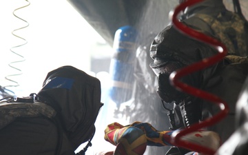 Chemical Company Decons a Civilian Role Player During Guardian Response 17